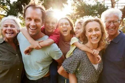 Multi-generational family enjoying time together outdoors during the holidays