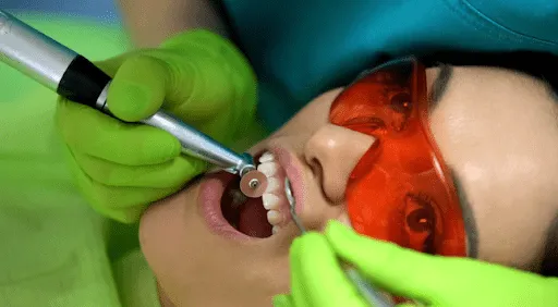 Woman examining a chipped tooth