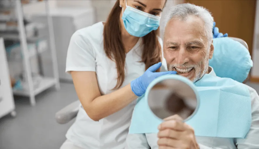 Dentist consulting with a patient about dental implant and bridge options