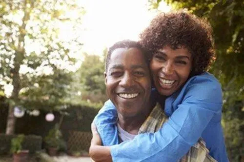 Mature couple smiling together outdoors