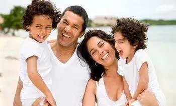 Family smiling together after a visit to Isaacs Family Dental