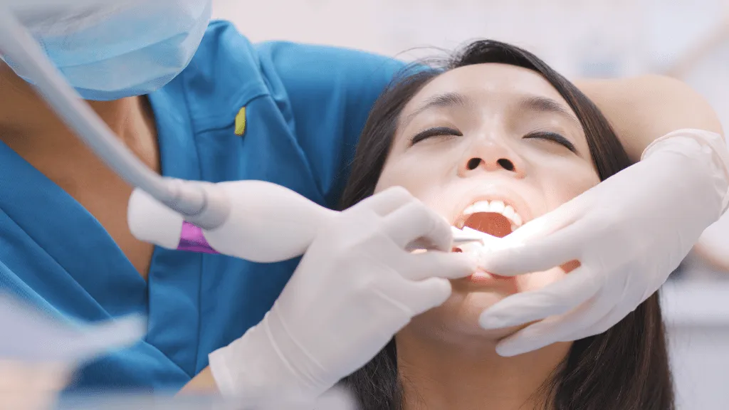 Dental patient receiving a checkup and cleaning at Isaacs Family Dental