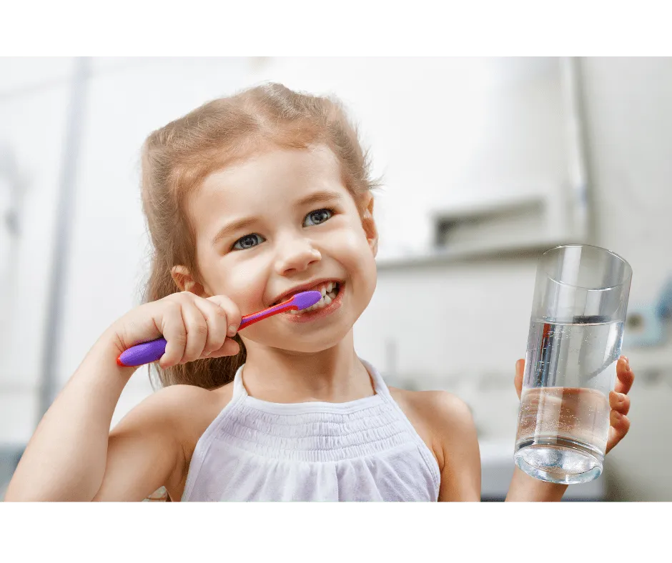Child learning proper toothbrushing technique at the dentist