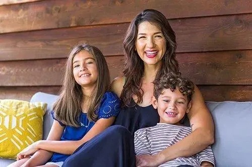 Mother and her children smiling together