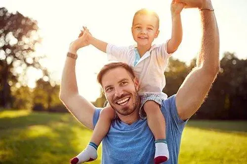 Happy father with son in the park