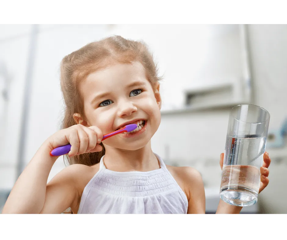 Pediatric dentist examining a young patient's teeth