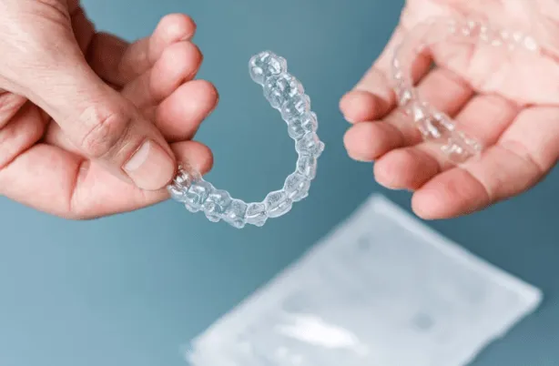 Clear aligner tray for adult orthodontic treatment