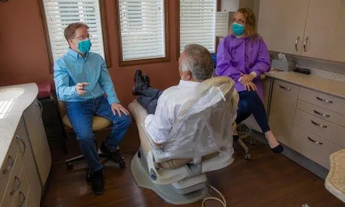 Dr. Isaacs consulting with a patient