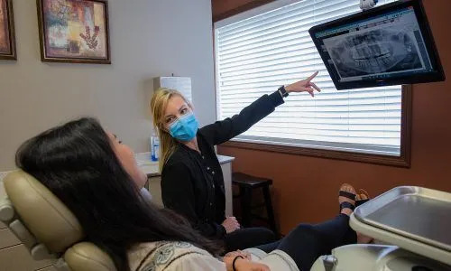 Patient consultation and X-ray review at Isaacs Family Dental