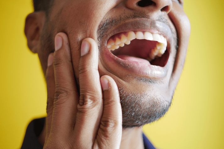 man with dental pain