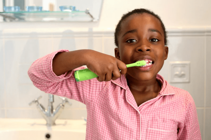boy brushing teeth