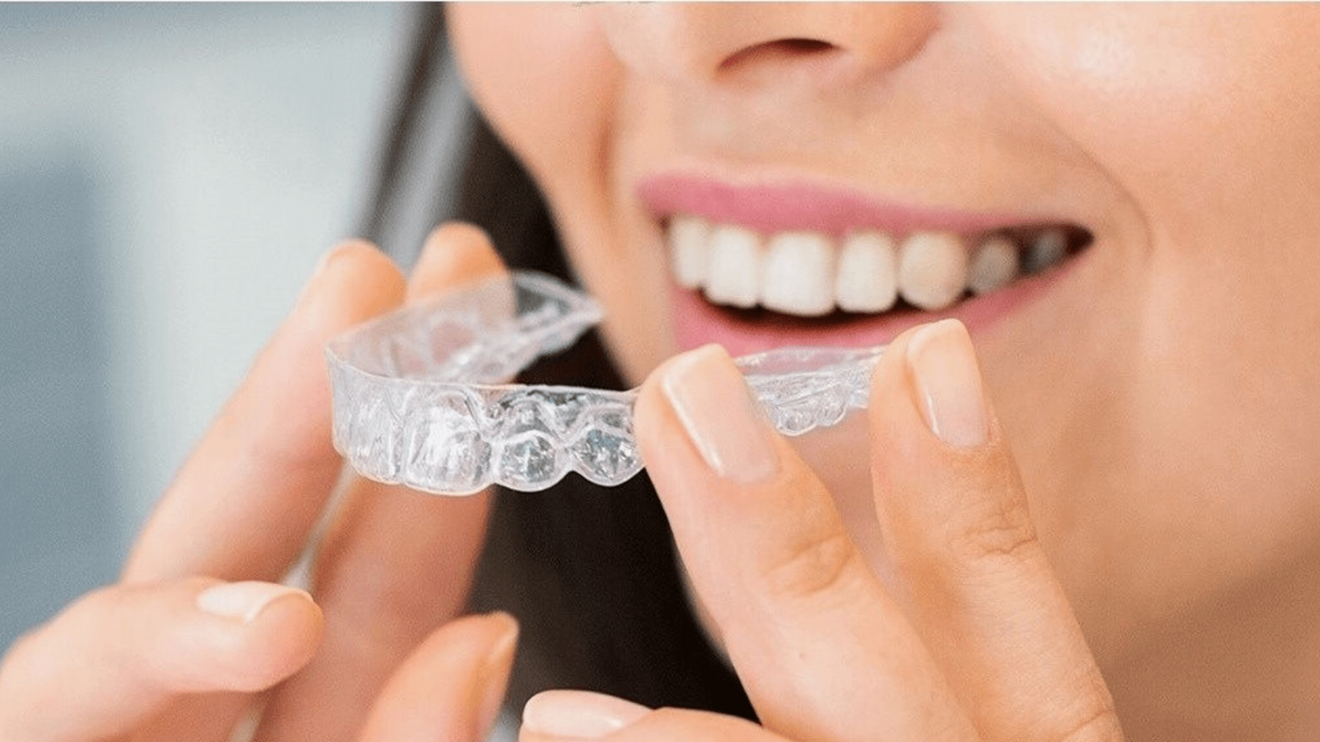 woman smiling with invisible braces