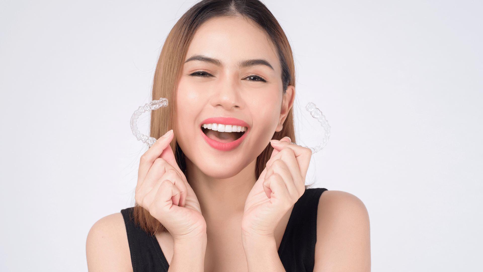 a woman smiling with suresmile