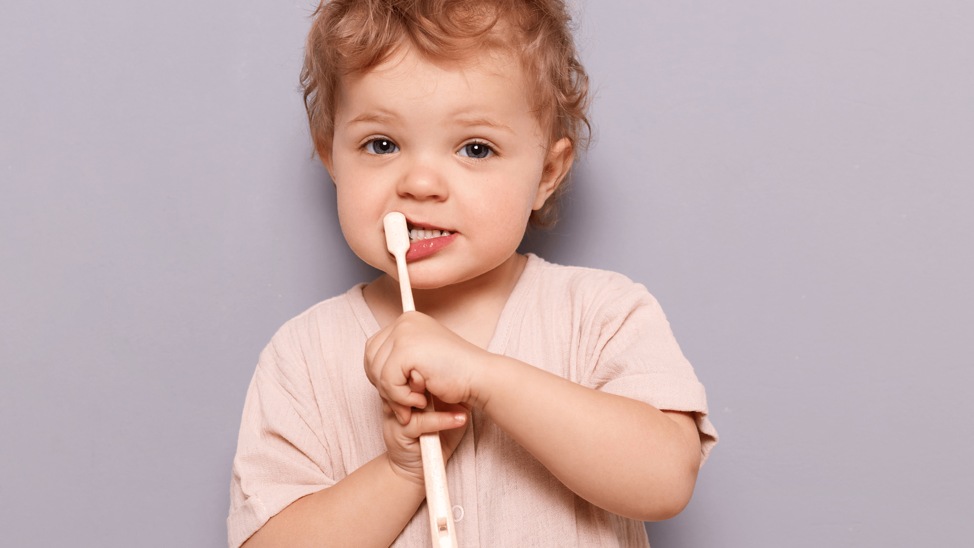 a kid with a toothbrush
